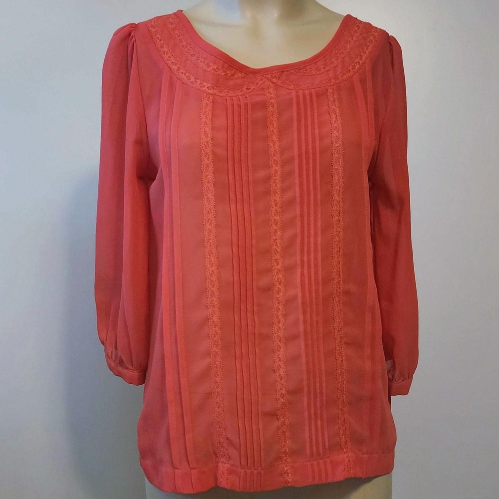 Coral sheer with lace and front pleats  and full button back, professional top